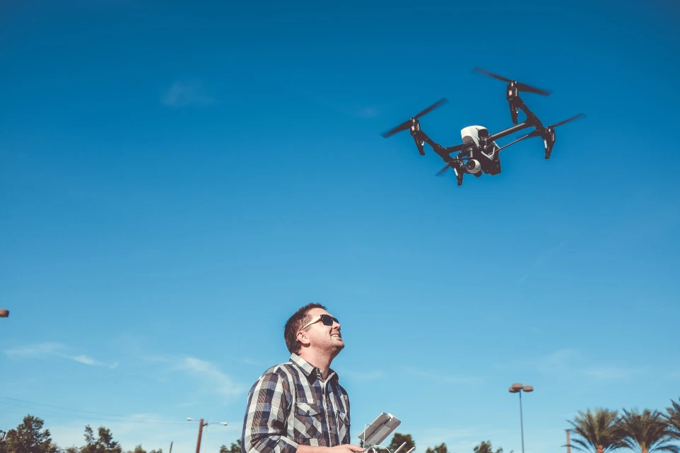 man flying drone